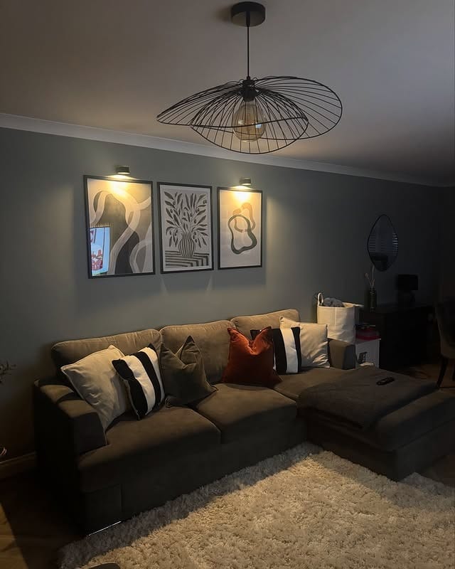 1. Soft Glow Contemporary Lounge in Charcoal and Warm Neutrals - lighting ideas for living room