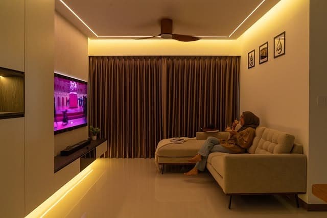 4. Ambient Cozy Living Room with Linear Ceiling Lighting - lighting ideas for living room