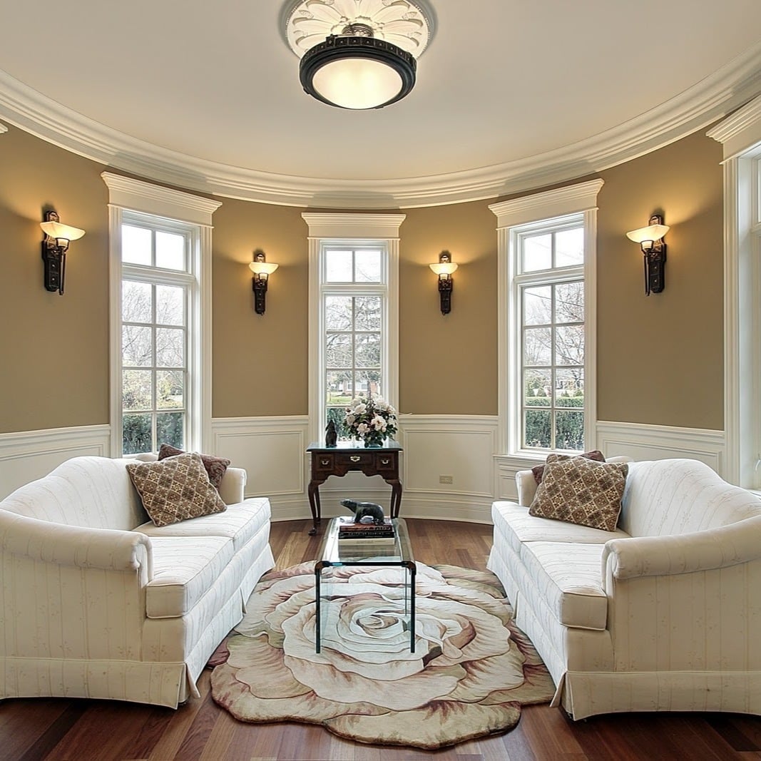 8. Classic Round Living Room with Traditional Sconce Lighting - lighting ideas for living room