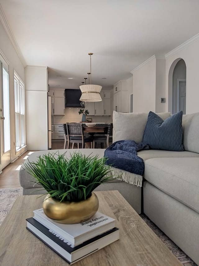 9. Light and Airy Open-Concept Living Room with Soft Pendant Lighting - lighting ideas for living room