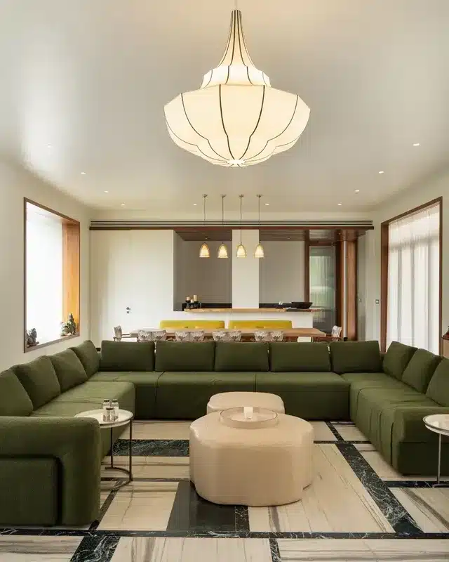 19. Soft Diffused Chandelier over Olive Green Seating - lighting ideas for living room