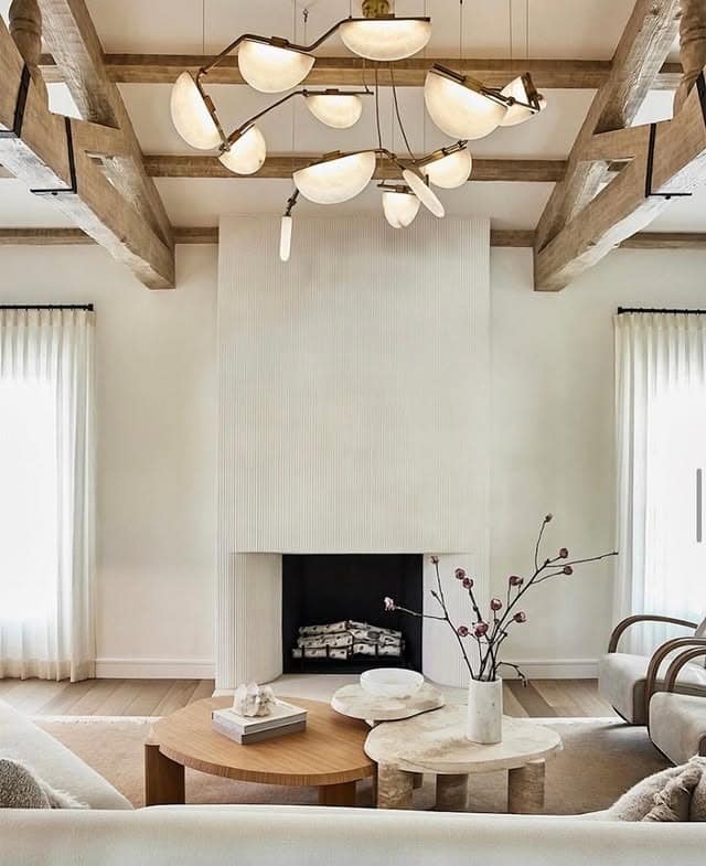 21. Sculptural Chandelier in a Soft Neutral Living Room - lighting ideas for living room