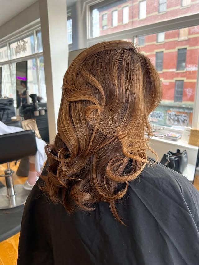 13. Golden Chestnut Curls with Polished Volume - Hair Color with Highlights