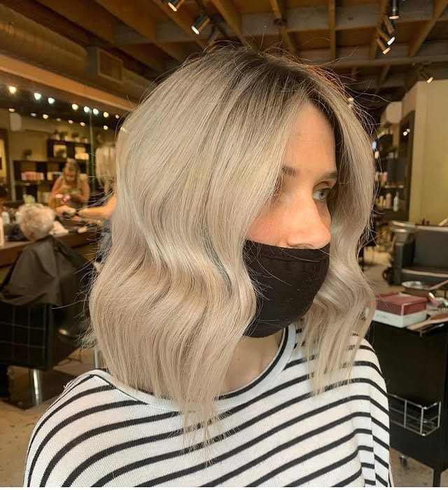 8. Platinum Sculpted Wave Bob - Chic-Length Hairstyles