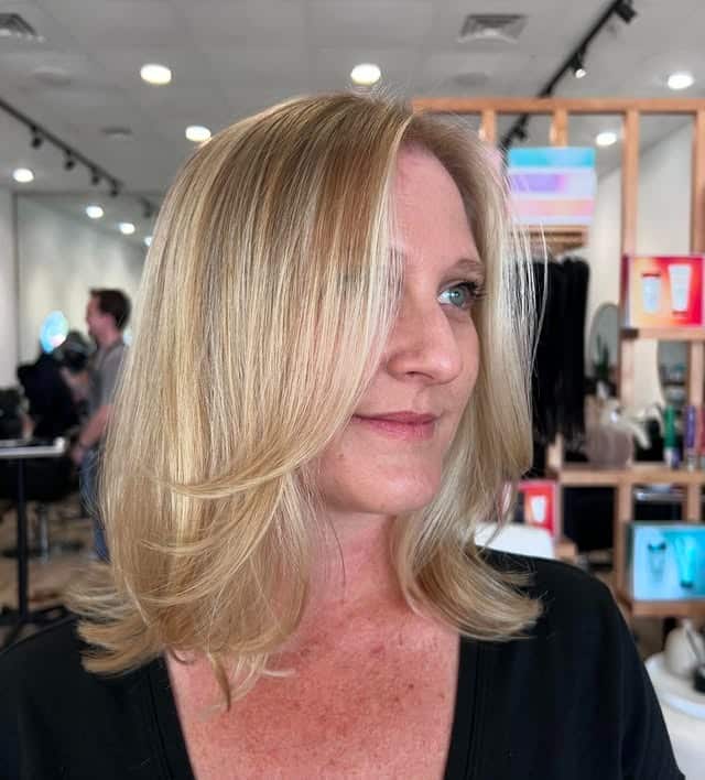 19. Feathered Blonde Medium-Length Cut - Chic-Length Hairstyles