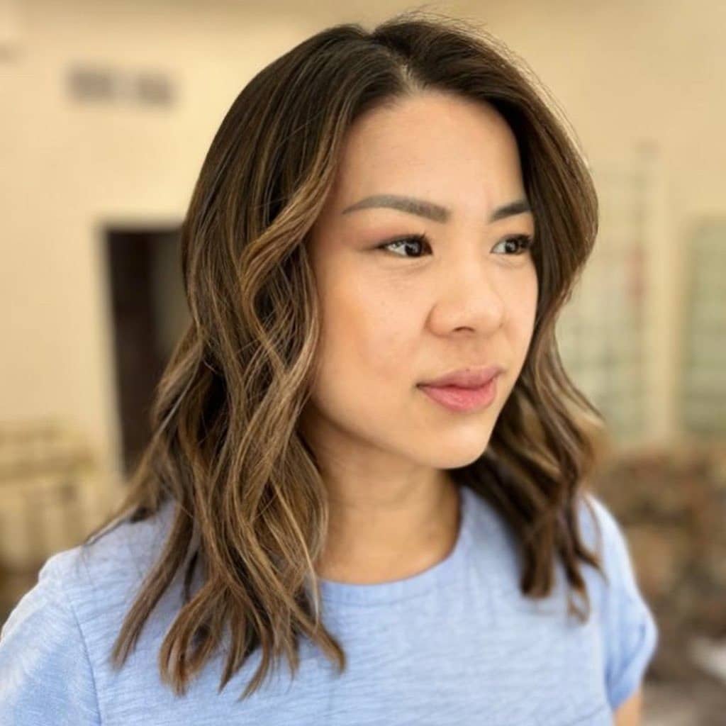 22. Dimensional Brunette Mid-Length Waves - Chic-Length Hairstyles