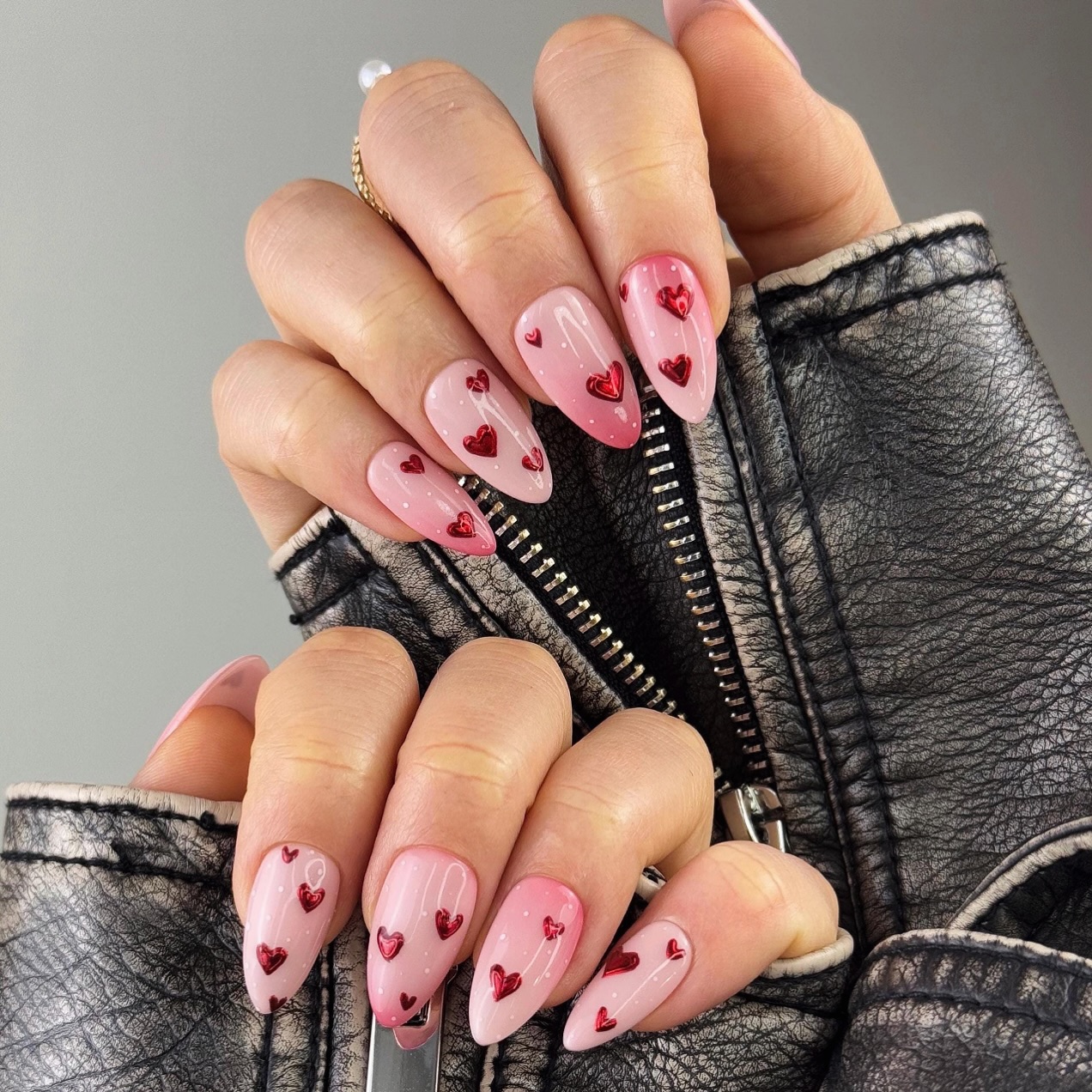 8. Glossy Pink Almond Nails with Red Heart Charms - girly nail ideas