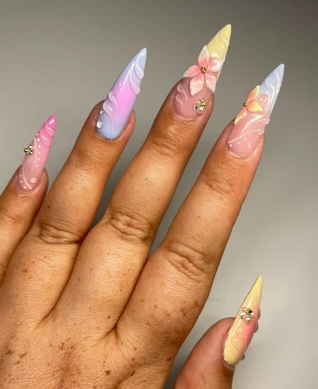 9. Pastel Sculpted Stiletto Nails with Floral 3D Art - girly nail ideas