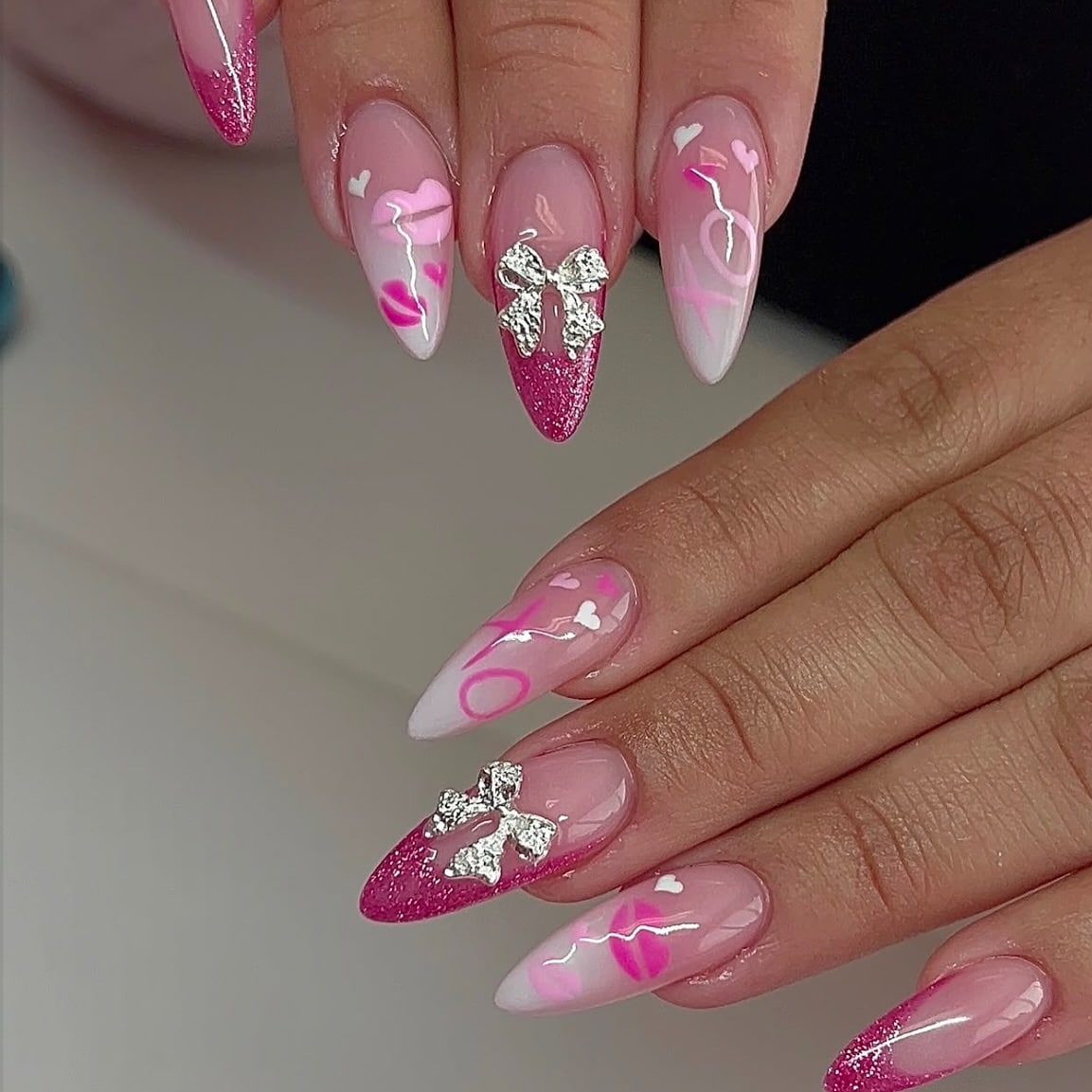 19. Pink XO Almond Nails with Charms and Glitter Tips - girly nail ideas