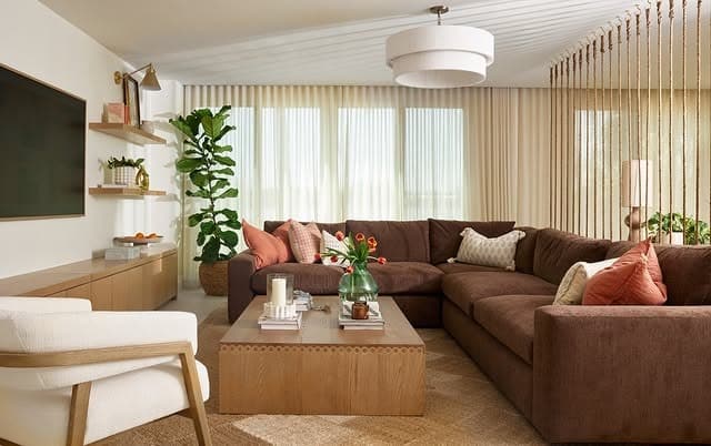 8. Soft Cocoa Sectional With Peach and Terracotta Accents - dark brown living room ideas