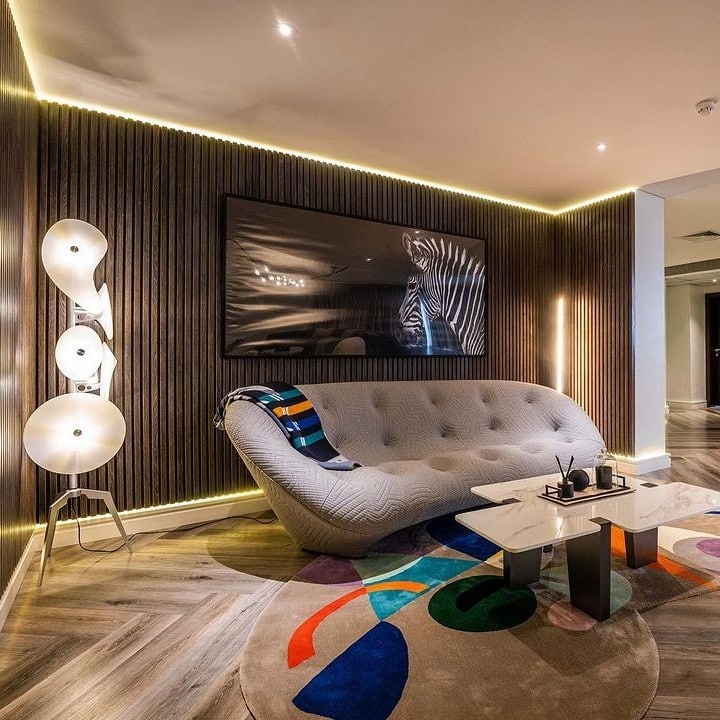 11. Contemporary Walnut Lounge With Sculptural Lighting - dark brown living room ideas