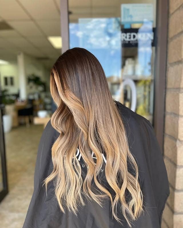 4. Golden Brunette Balayage with Cascading Waves - Brunette Balayage Hair Color