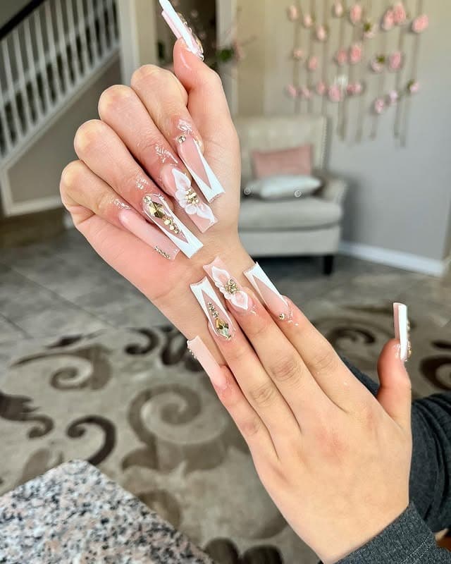 5. Long Sculpted French with Gold Jewel Art - gold and white nail ideas