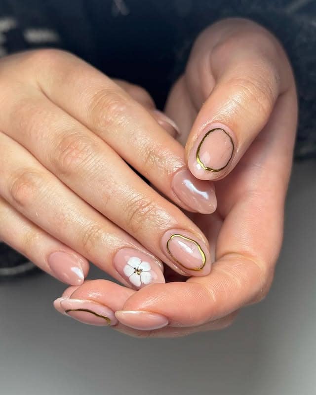 14. Minimal Gold-Outlined Petal Art - gold and white nail ideas