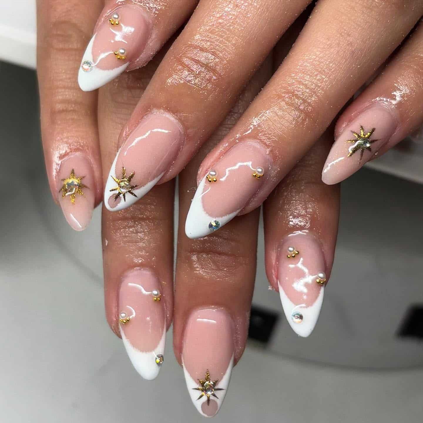 15. White Angled French with Gold Star Accents - gold and white nail ideas