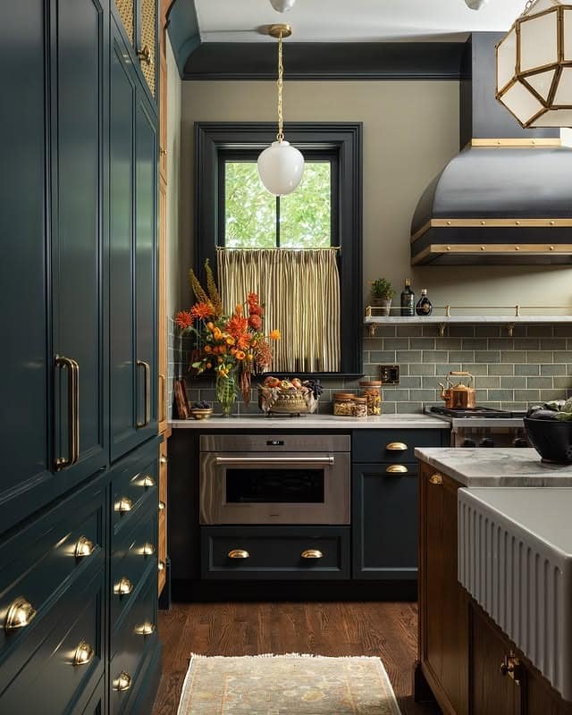 12. Deep Teal Cabinetry with Brass-Lined Shelf Accent - kitchen ideas with shelves