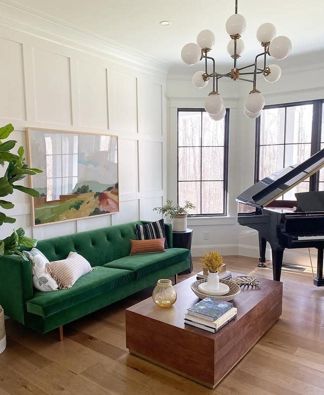 2. Classic Green Sofa with Artistic Warmth - green couch living room ideas