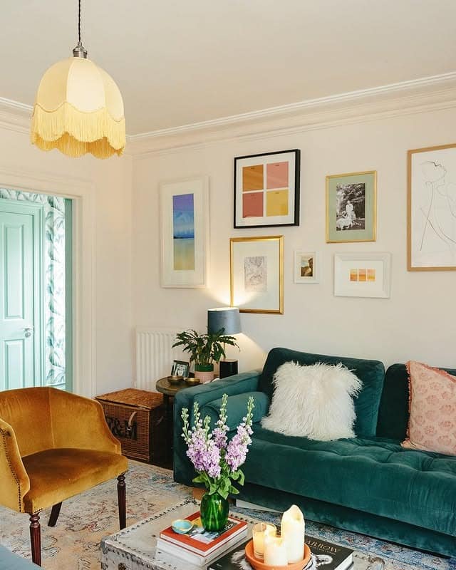 5. Teal Velvet Sofa with Soft Pastel Accents - green couch living room ideas