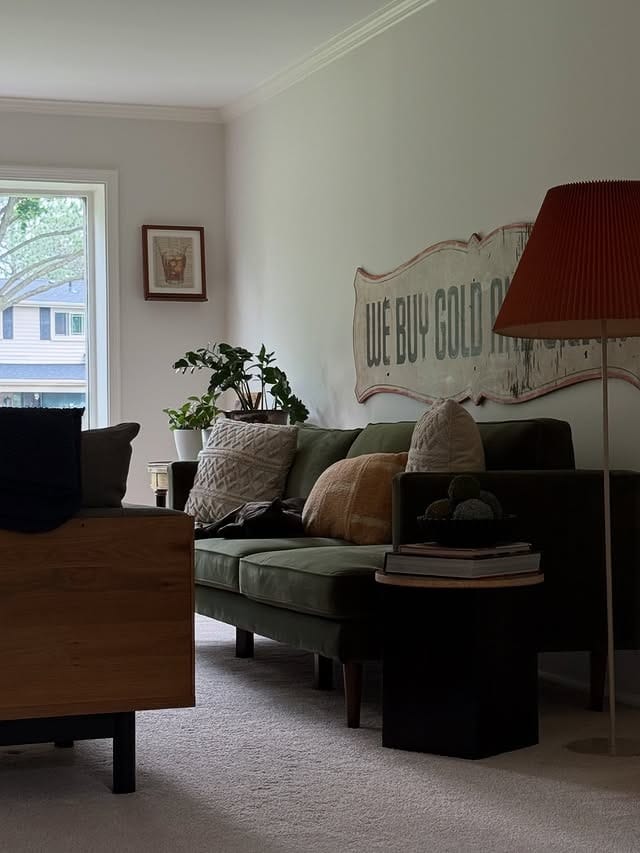 9. Cozy Olive Sofa with Vintage Character - green couch living room ideas