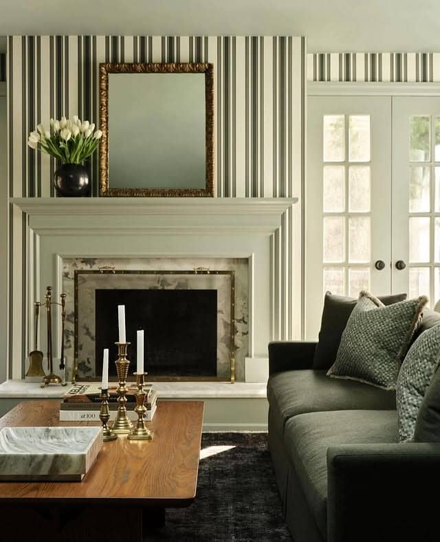 20. Charcoal Green Sofa with Classic Striped Walls - green couch living room ideas