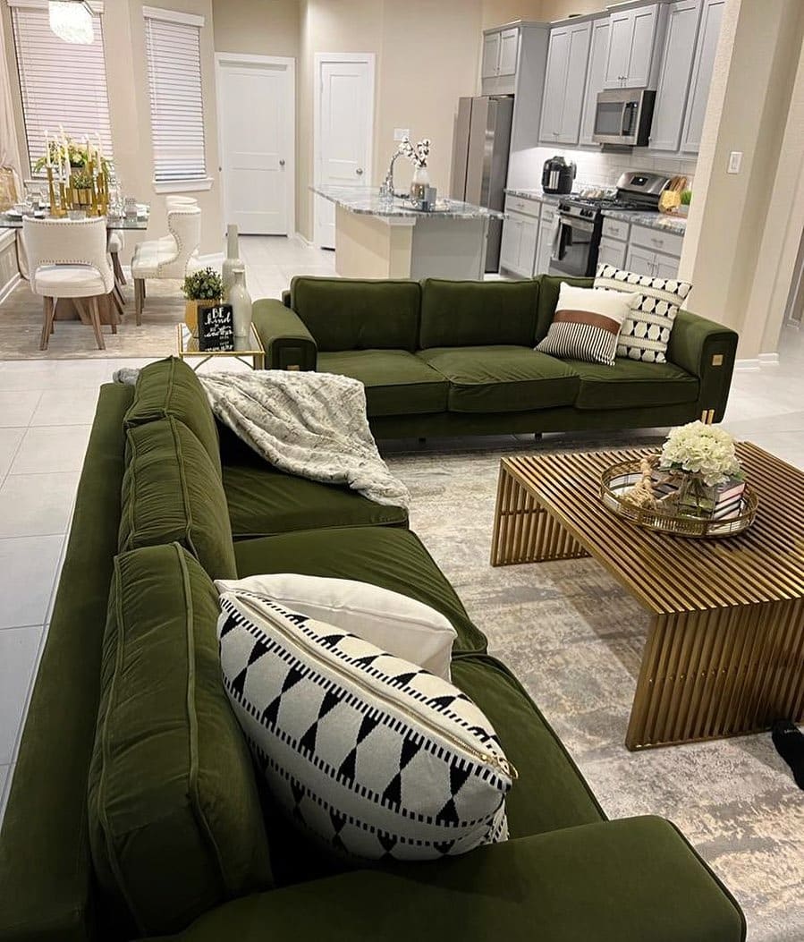 22. Forest Green Seating in a Polished Open-Concept Home - green couch living room ideas