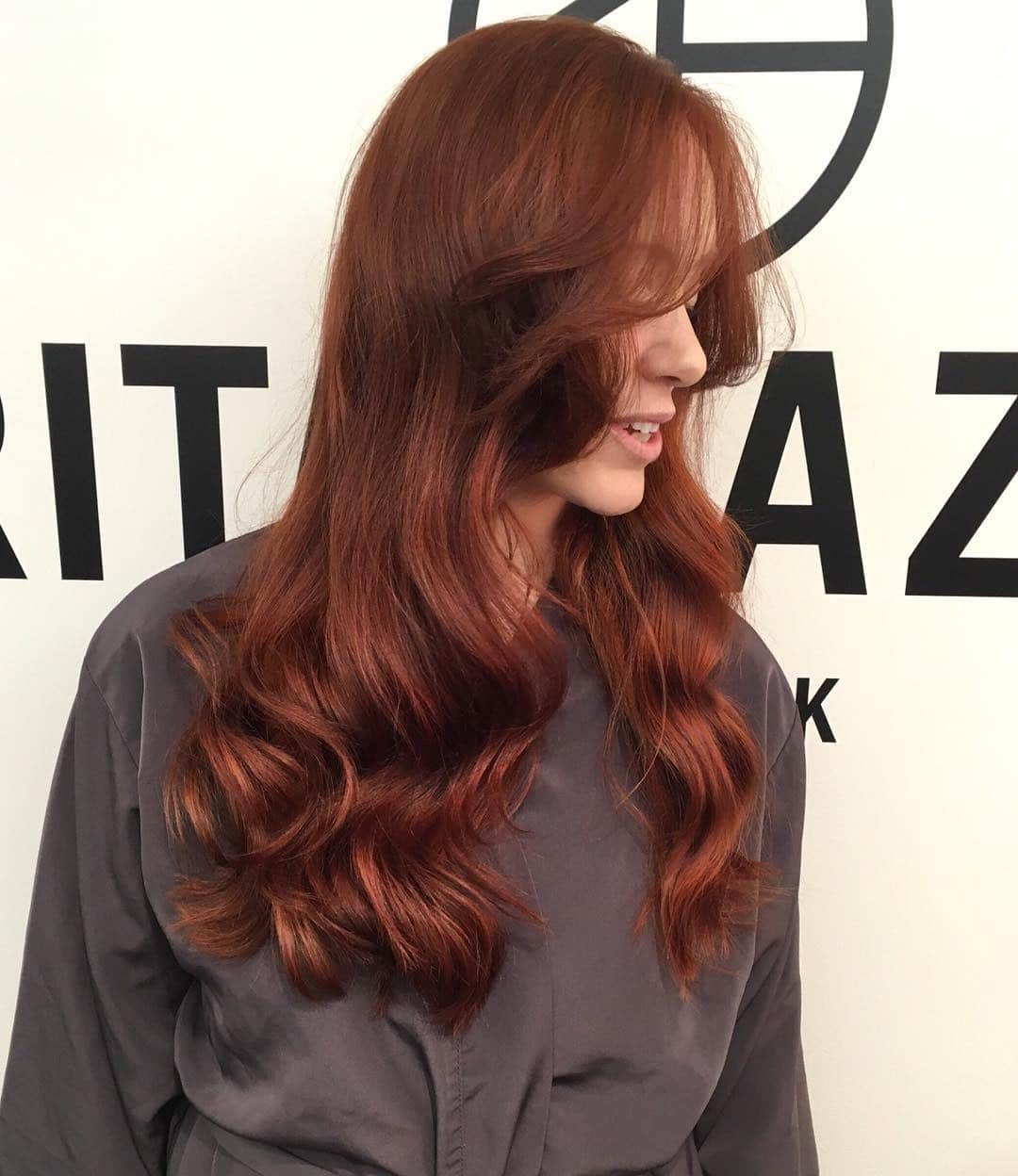 5. Long Layered Cut with Rich Auburn Shine - Dark Auburn Hair Color