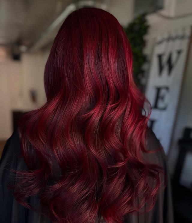 5. Dark Cherry Red with Long Cascading Layers - Red Hair Color