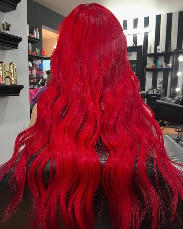 7. Bright Scarlet Red with Textured Length - Red Hair Color