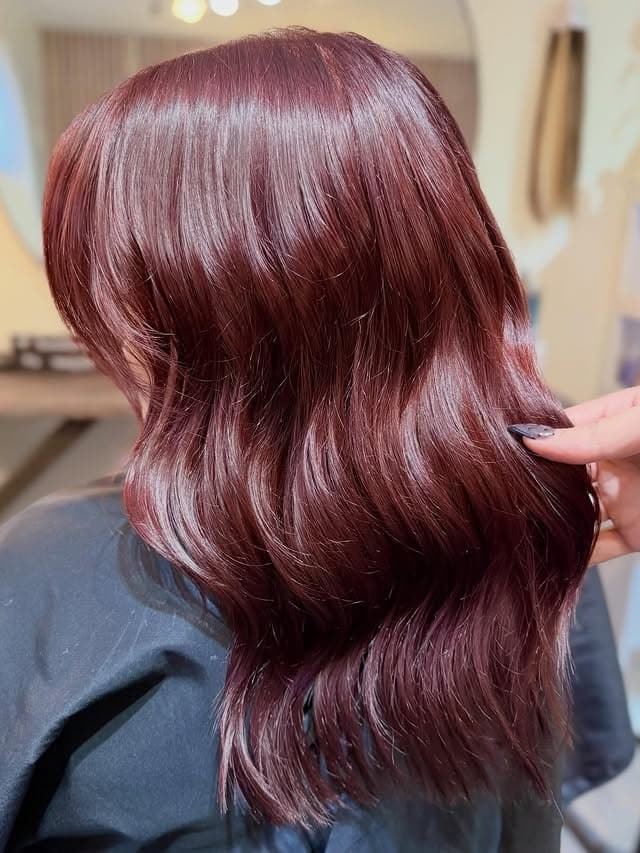 17. Glossed Wine Red with Mid-Length Layers - Red Hair Color