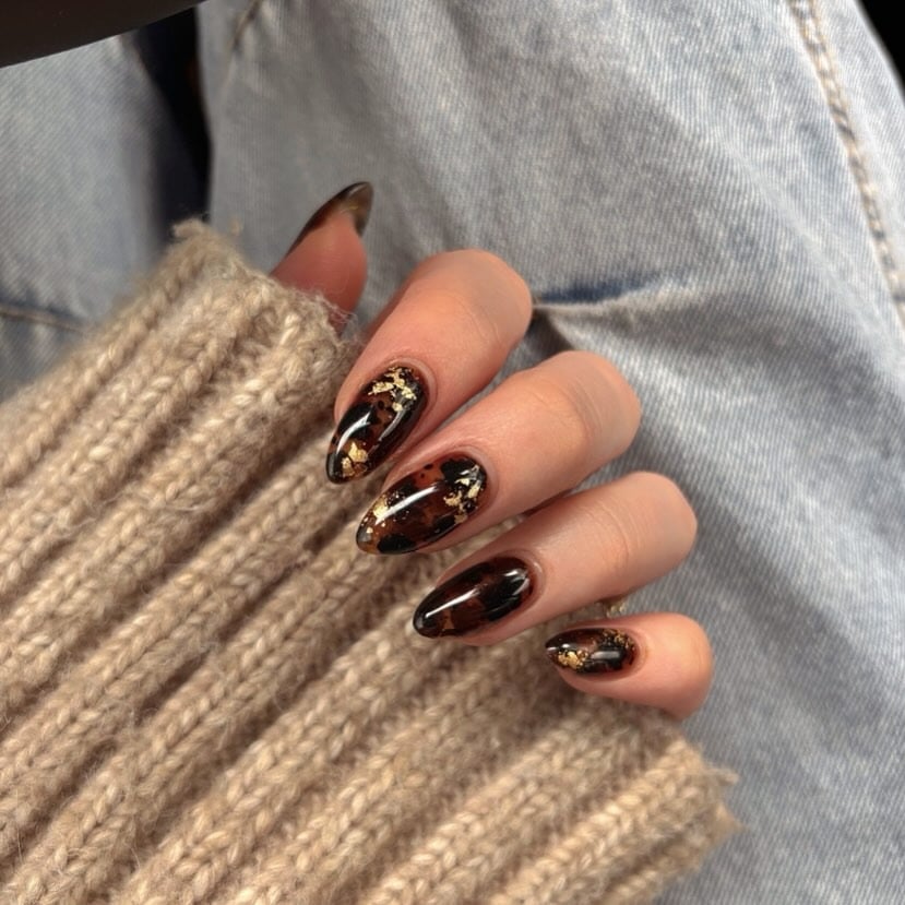 6. Dark Tortoiseshell Nails with Gold Foil Details - gold foil nail ideas