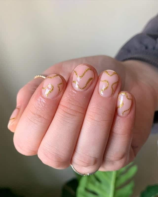 12. Short Nude Nails with Gold Foil Line Art - gold foil nail ideas