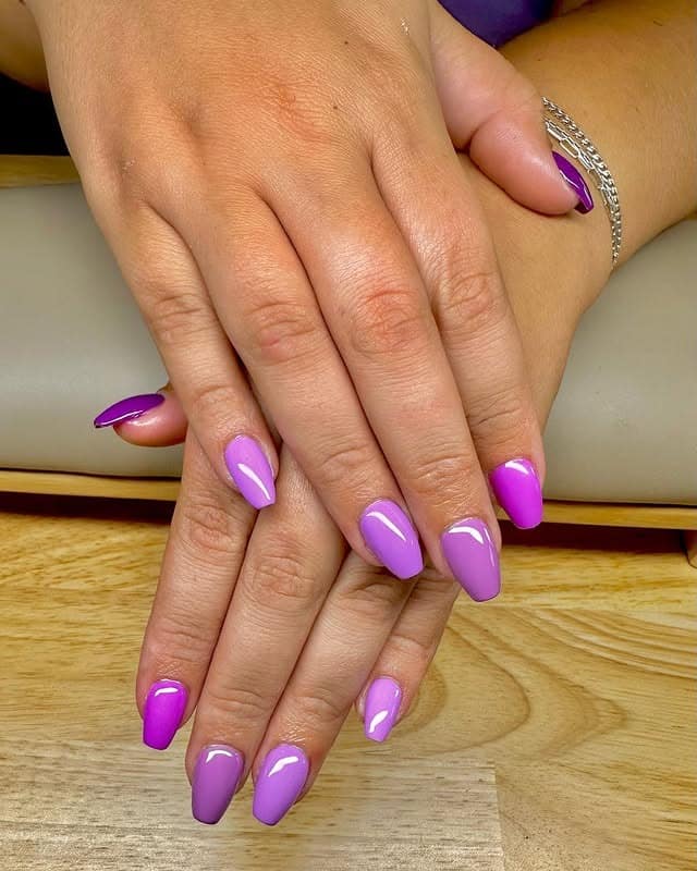 2. Glossy Violet Gradient Almond Nails - gradient nail ideas