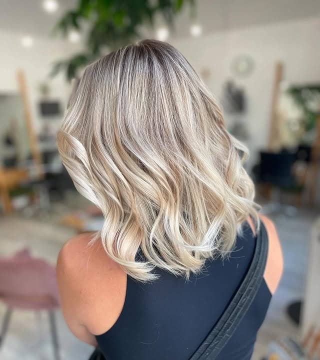 13. Icy Blonde Textured Long Bob - Short Blonde Hairstyles