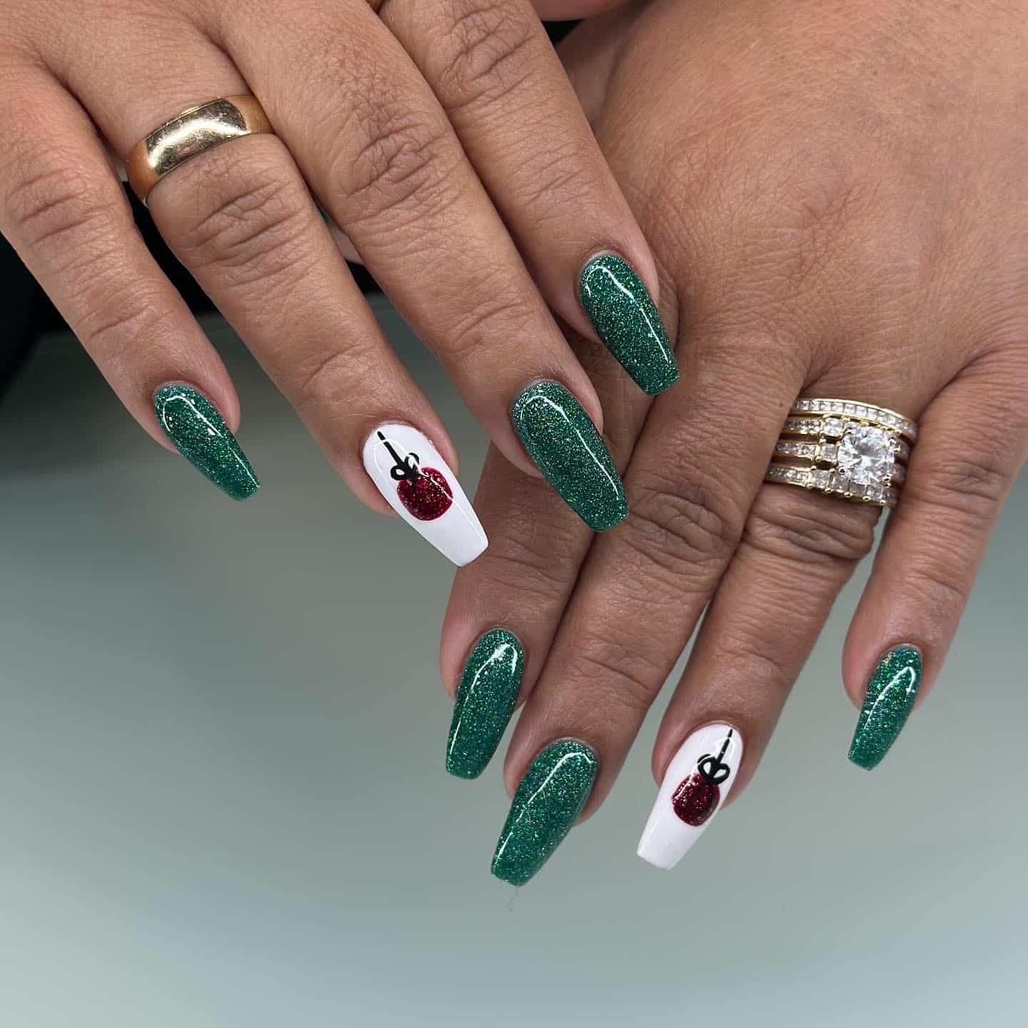 2. Emerald Glitter Statement with Graphic Accent - green and white nail ideas