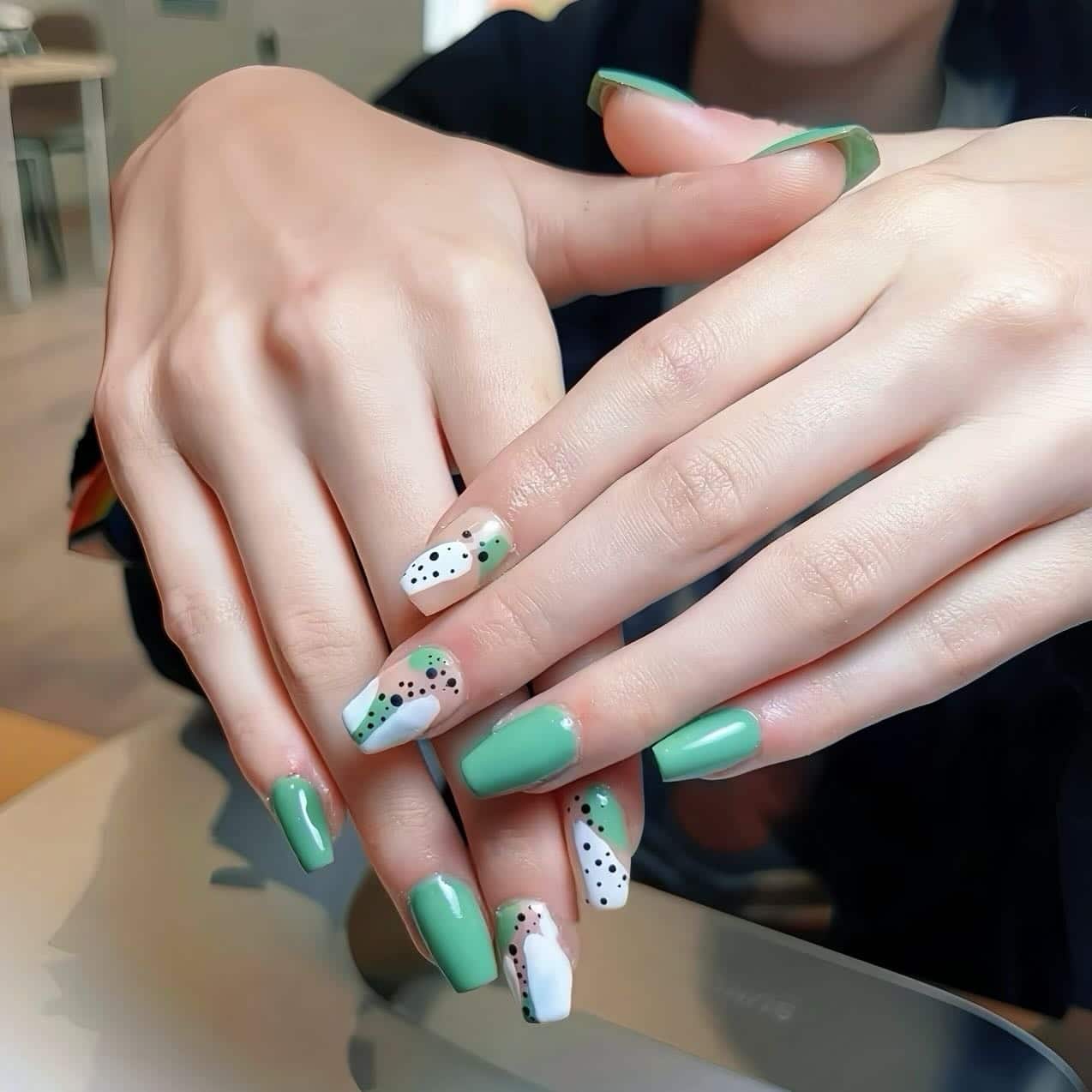 8. Mint Green and Abstract Dot Design - green and white nail ideas