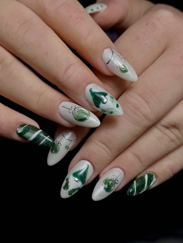 16. Green Ornament Art on White Almond Nails - green and white nail ideas