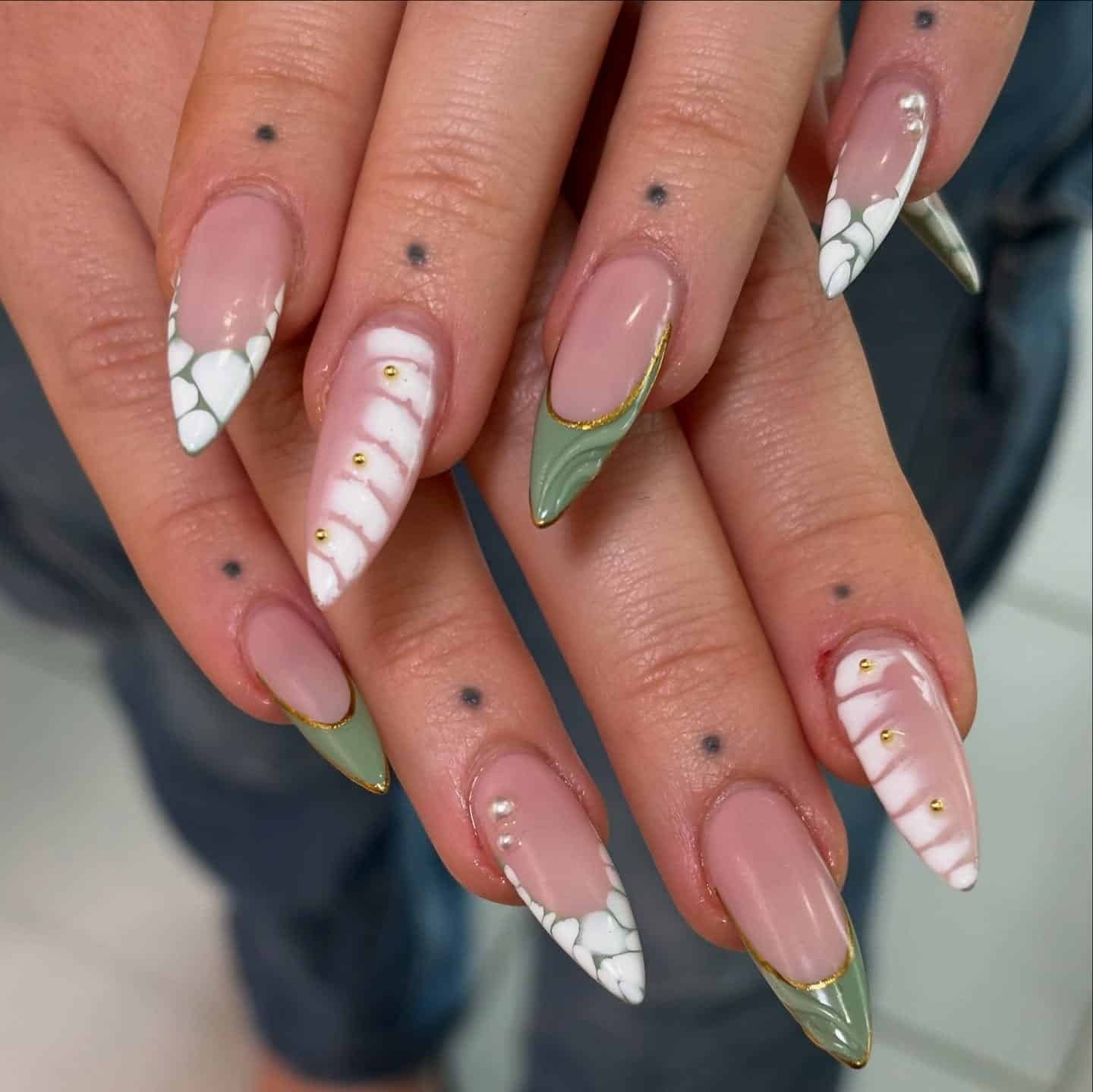 17. Mixed French and Sculpted Green Detail Stilettos - green and white nail ideas