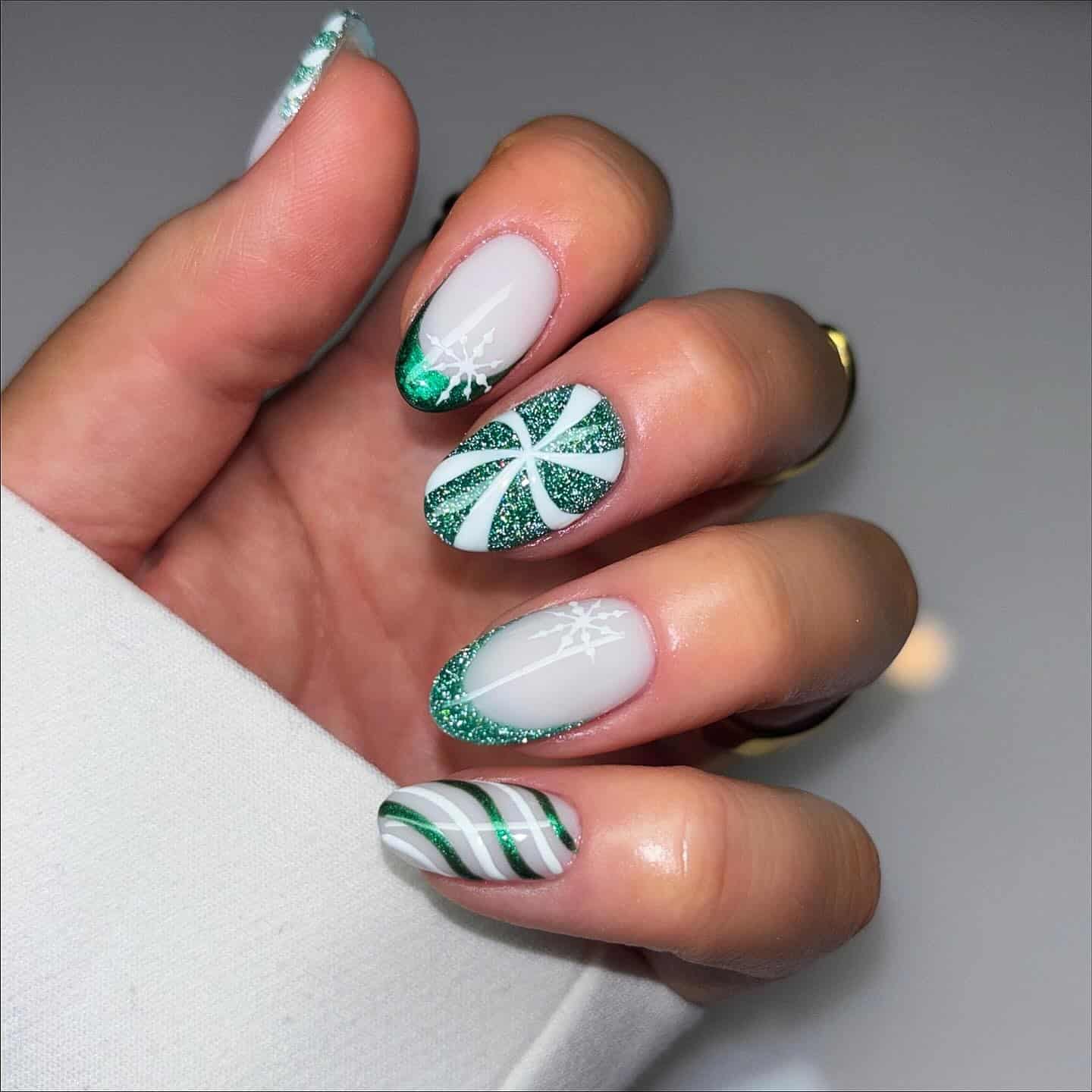 18. Green Glitter and White Graphic Almond Nails - green and white nail ideas