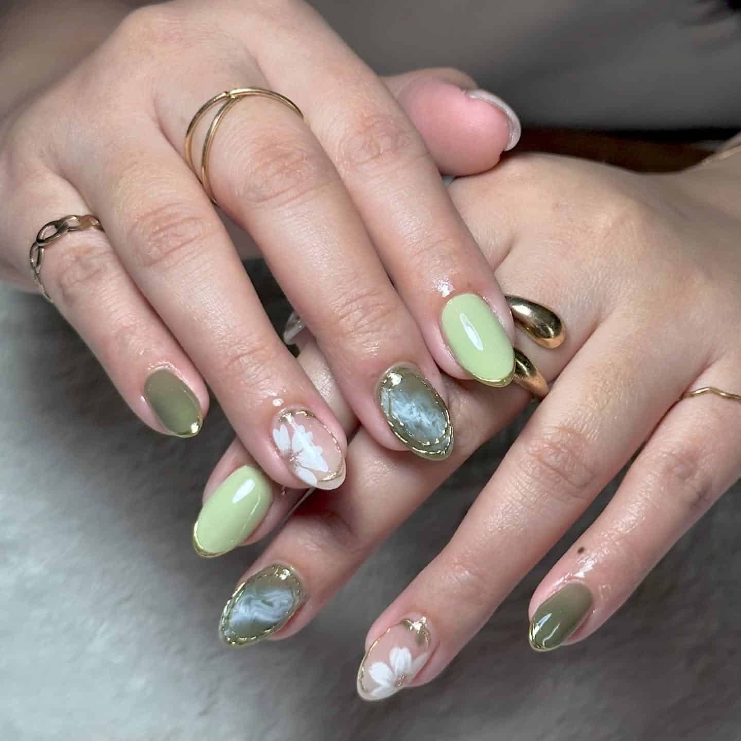 21. Mixed Green Botanical Nails with Gold Framed Accents - green and white nail ideas