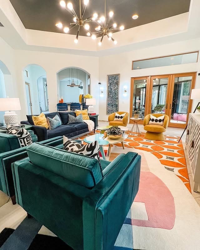 3. Bold Glam Color Play in Jewel and Citrus Tones - glam living room ideas