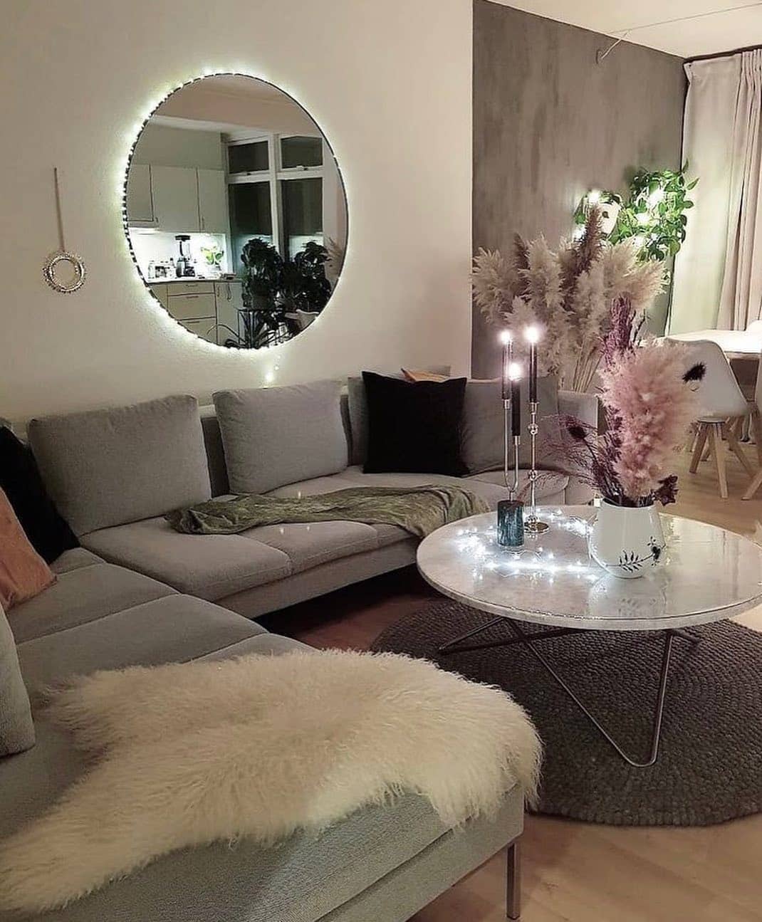 5. Cozy Glam with Soft Gray and Ambient Lighting - glam living room ideas