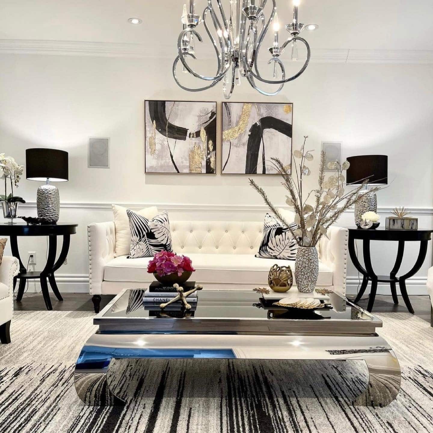 19. Black and White Glam with Polished Metallic Layers - glam living room ideas