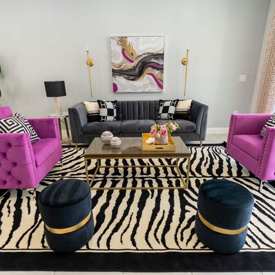 21. Bold Glam Contrast with Black, Magenta, and Gold - glam living room ideas