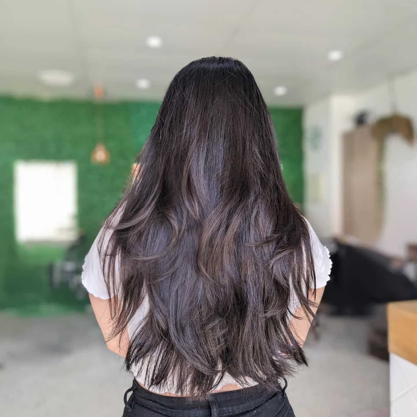 4. Glossy Jet Black Long Layers with Soft Ends - Long Layered Hairstyles