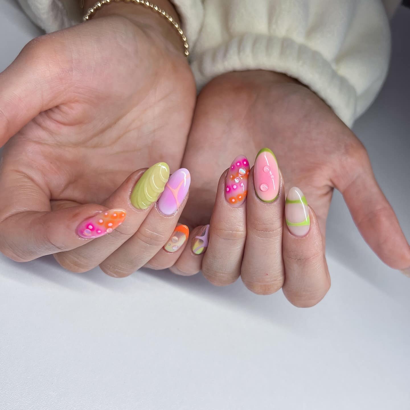 1. Pastel Pop Swirl Almond Nails - groovy nail ideas
