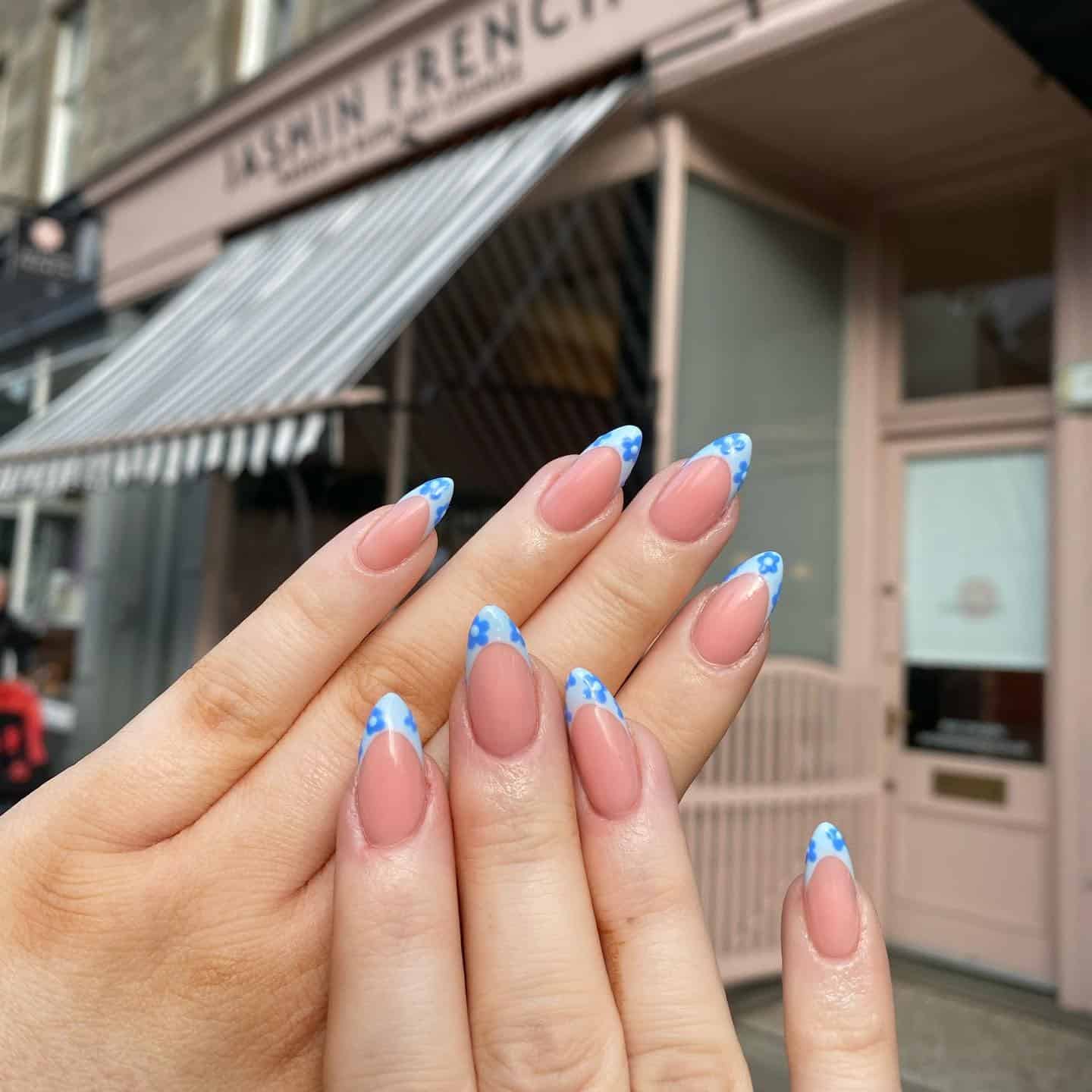 4. Blue Daisy French Tip Almond Nails - groovy nail ideas