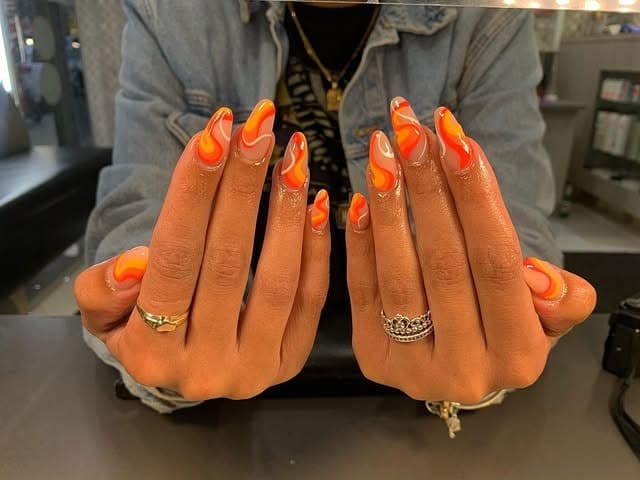 5. Citrus Flame Almond Nails in Orange and Yellow - groovy nail ideas