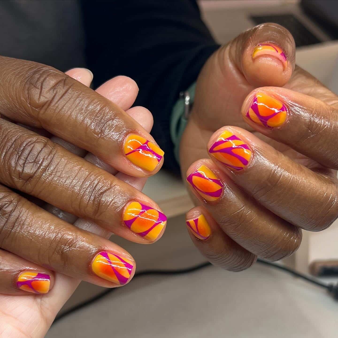 7. Short Retro Swirl Nails in Orange and Magenta - groovy nail ideas