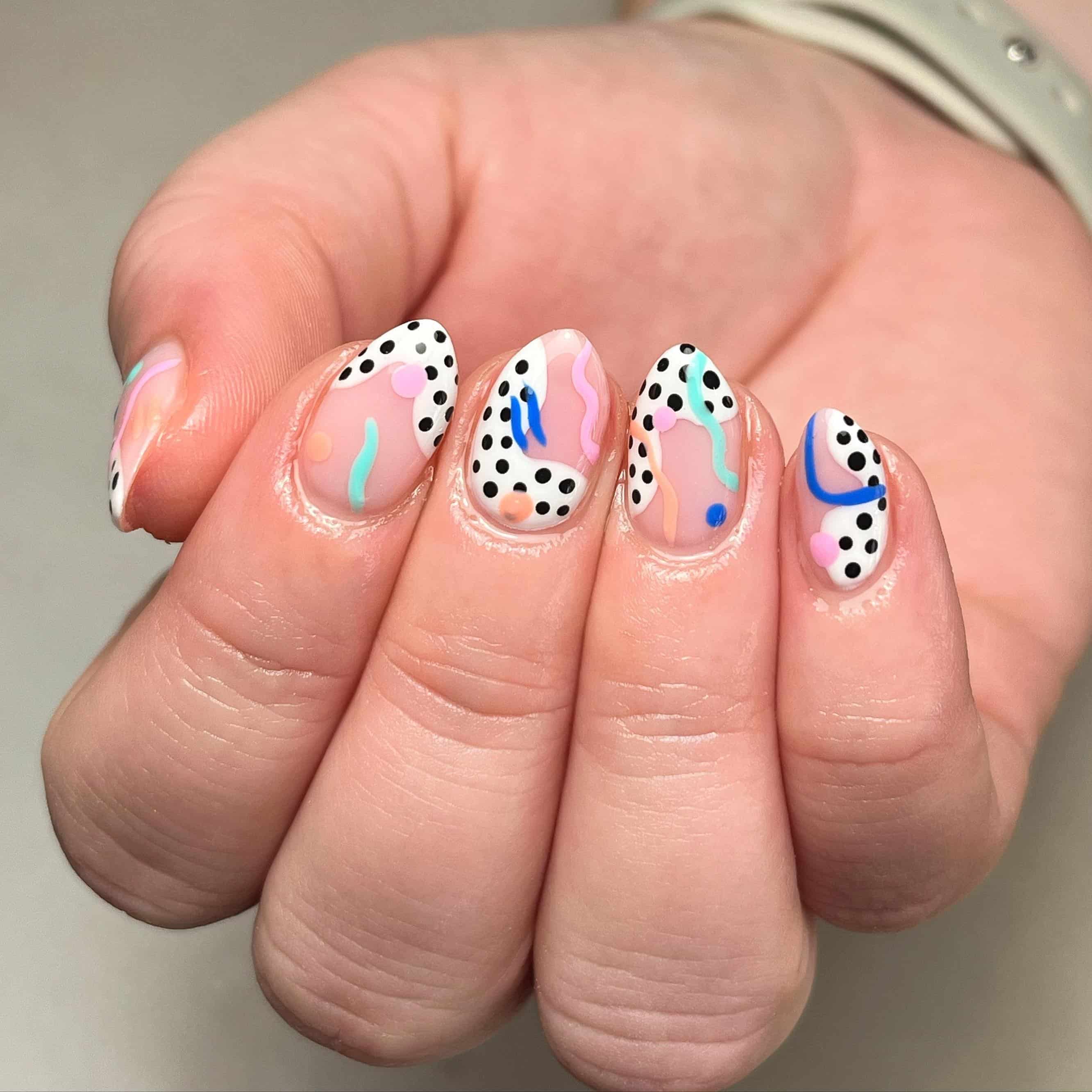 12. Polka Dot Swirl Short Nails in Pastel and Black - groovy nail ideas