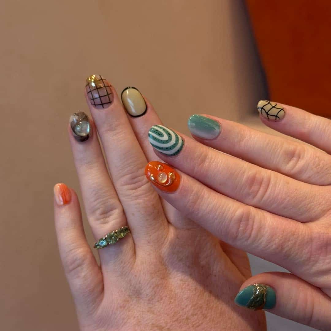 17. Abstract Retro Almond Nails in Sage and Orange - groovy nail ideas
